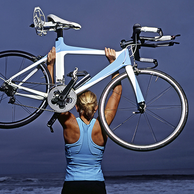 Woman holding bicycle